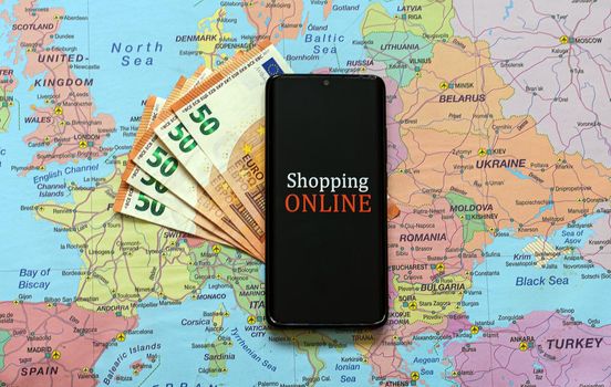 Mobile phone on Europe map. Online shopping concept.