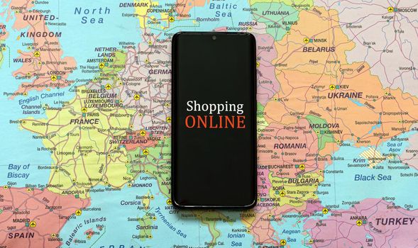 Mobile phone on Europe map. Online shopping concept.
