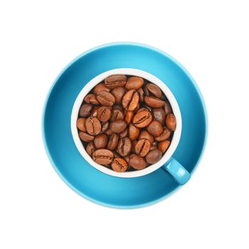 Close up one cup full of roasted coffee beans on blue saucer isolated on white background, elevated top view, directly above