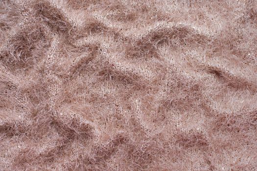 brown synthetic seamless fabric, fleecy, waves, texture background. High quality photo