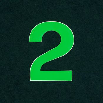 Green number two digit over black background