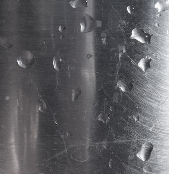 droplets of water on grey steel texture useful as a background