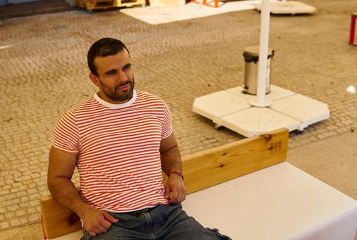 Man sitting on a terrace in summer