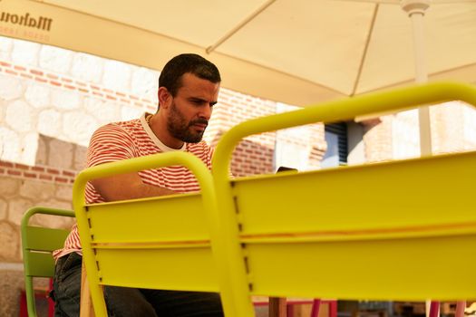 Man sitting on a terrace in summer