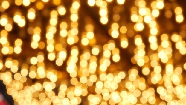 Defocused old fasioned electric lamps glowing at night. Abstract close up of blurred retro casino decoration shimmering, Las Vegas USA. Illuminated vintage style bulbs glittering on Freemont street.