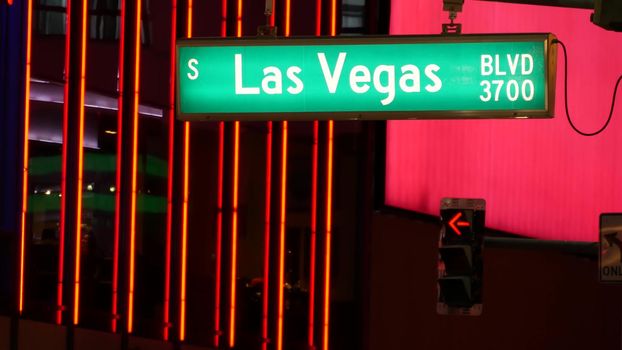 Fabulos Las Vegas, traffic sign glowing on The Strip in sin city of USA. Iconic signboard on the road to Fremont street in Nevada. Illuminated symbol of casino money playing and bets in gaming area.