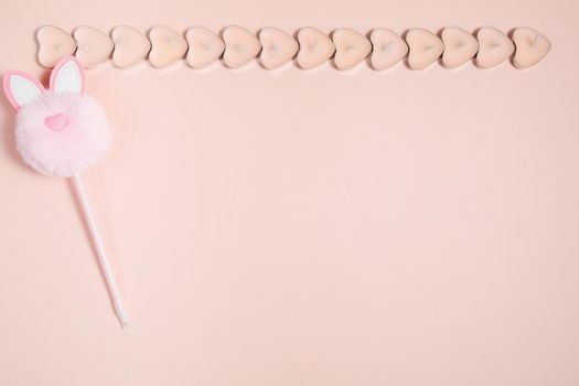 Valentine's Day, composition of hearts on a pink background. View from above. Space for text, flat lay