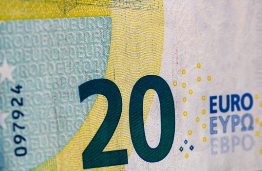 Selective focus on detail of euro banknotes. Close up macro detail of money banknotes, 20 euro isolated. World money concept, inflation and economy concept