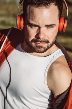 Portrait of a handsome young man in casual clothes enjoying music on your mobile phone