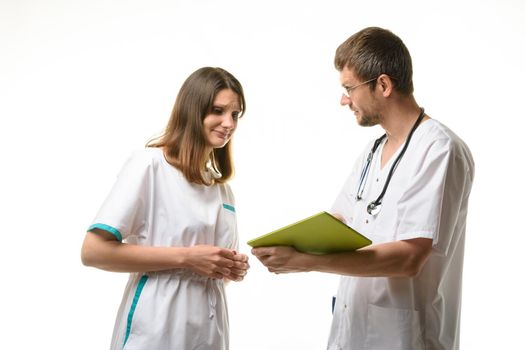 The head of the department shows the doctor the error in the diagnosis of the patient