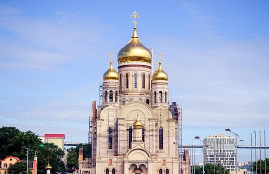 Urban landscape with a view of the Golden domes of the temple. Vladivostok, Russia