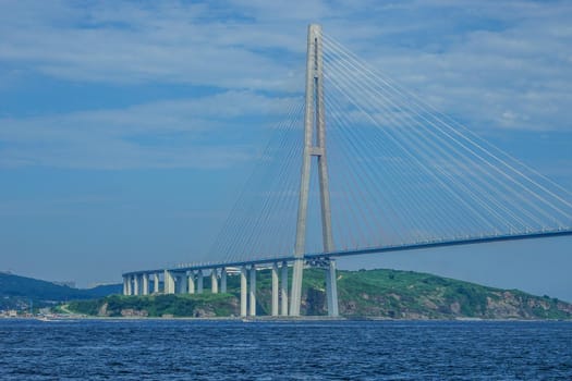 Vladivostok, Primorsky Krai. Seascape with views of the construction of the Russian bridge.