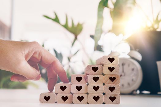 Heart icon on wooden step board with blank copy space background. Valentine love holiday concept.