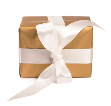 gift packed into golden box with White Ribbon isolated