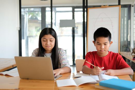 asian boy girl student studying learning lesson online. remote meeting distance education at home