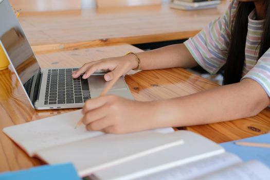 asian girl student studying learning lesson online. remote meeting distance education at home