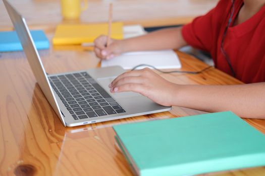 asian boy student studying learning lesson online. remote meeting distance education at home