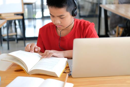 asian boy student studying learning lesson online. remote meeting distance education at home