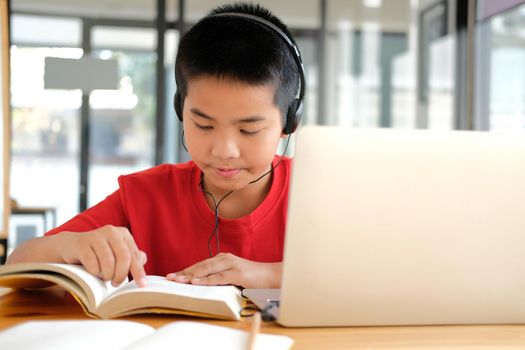 asian boy student studying learning lesson online. remote meeting distance education at home