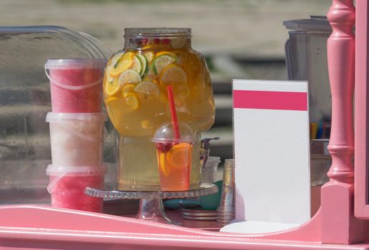 Trade counter with drinks and cotton candy pink. Clean plate for the menu.