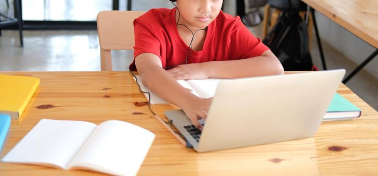 asian boy student studying learning lesson online. remote meeting distance education at home