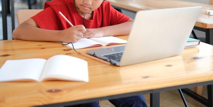 asian boy student studying learning lesson online. remote meeting distance education at home