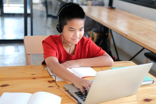 asian boy student studying learning lesson online. remote meeting distance education at home