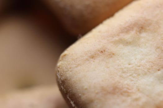 Close up top view of of biscuit cookies. Close up view rectangular biscuits with small pores