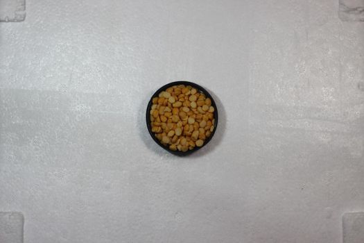 Top view of cereals on white background with copy space. Split Chickpea Also Know as Chana Dal or Toor Dal