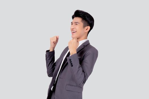 Portrait businessman in suit standing with win success isolated on white background, young asian business man is manager or executive having confident and excited is positive, expression and emotion.