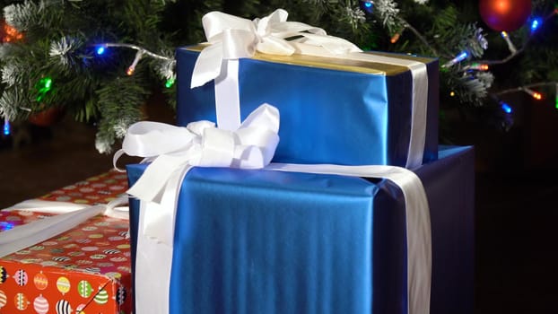 Decorated christmas tree with colorful balls and gifts. Christmas and New Year decorated interior room with presents and New year tree.