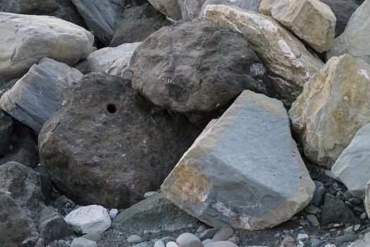 huge stones lying on the sea to protect the shore from blur