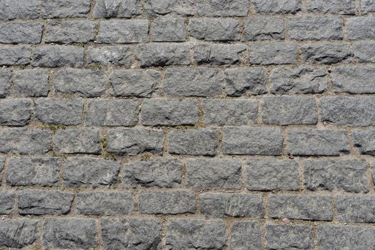 Grey brick wall background for design.