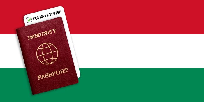 Concept of Immunity passport, certificate for traveling after pandemic for people who have had coronavirus or made vaccine and test result for COVID-19 on flag of Hungary