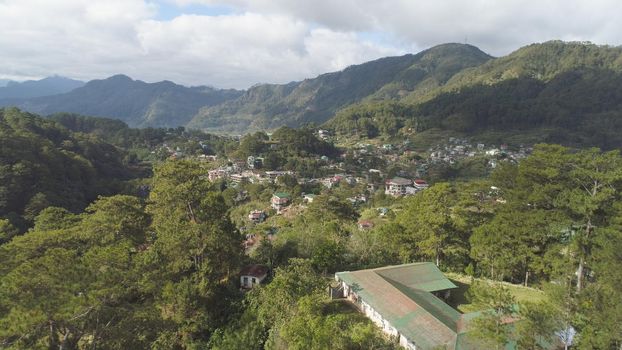 Aerial view town of Sagada, located in the mountainous province of Philippines. City in the valley among the mountains covered with forest. Sagada-Cordllera region-Luzon island.