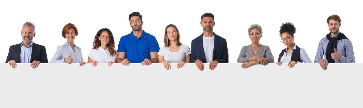 Group of business people in casual clothes holding blank banner ad isolated on white background