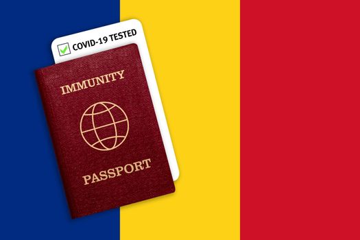 Concept of Immunity passport, certificate for traveling after pandemic for people who have had coronavirus or made vaccine and test result for COVID-19 on flag of Romania