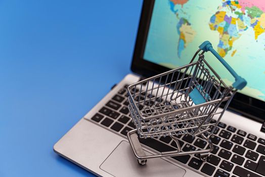 Empty shopping cart on laptop. Online shopping concept.