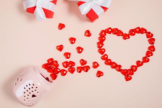 Valentine's Day, composition of hearts on a pink background. View from above. Space for text, flat lay