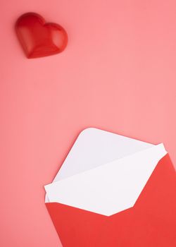 open envelope with blank, heart on pink background