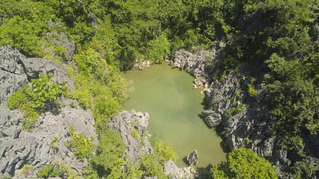 Aerial view Mountain Matukad lake,on a tropical island with green water. Lake in the mountains covered with tropical forest. Matukad Lagoon