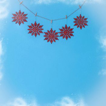 Christmas blue background with red snowflakes