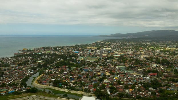 Cityscape of Iligan, with residential areas. Mindanao, Philippines. City in Asia view from above. Iligan City, Lanao del Norte.