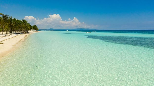 Beautiful tropical beach with white sand and turquoise ocean. Panglao island, Bohol, Philippines.