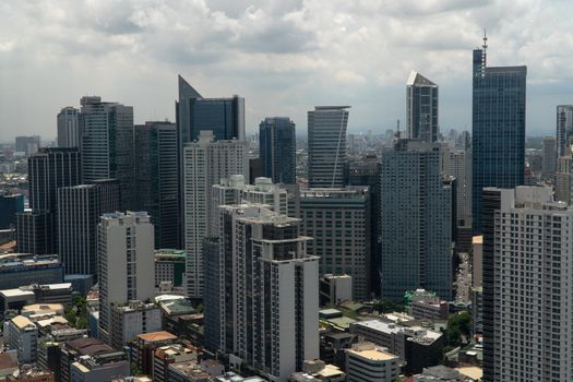 Populous city of Manila, the capital of the Philippines with skyscrapers, streets and buildings. Travel vacation concept.