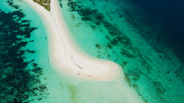 Tropical island with sand beach, top view. Little Santa Cruz Island near Zamboanga city. Mindanao, Philippines.
