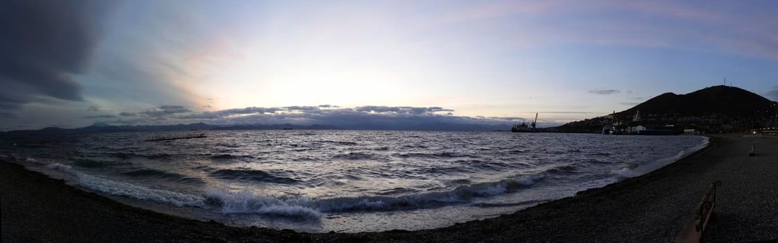 Panorama of the sea landscape in the evening on the waterfront of the city. Petropavlovsk-Kamchatsky, Russia.