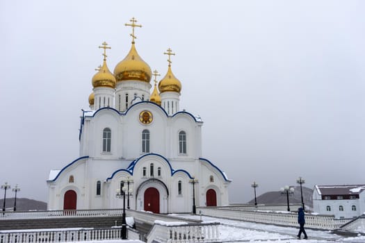 Petropavlovsk-Kamchatsky, Russia-October 6, 2019: the Church of St. Nicholas against a white snowy sky.