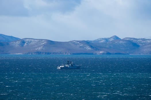 Seascape with a warship in Avacha Bay. Kamchatka, Russia