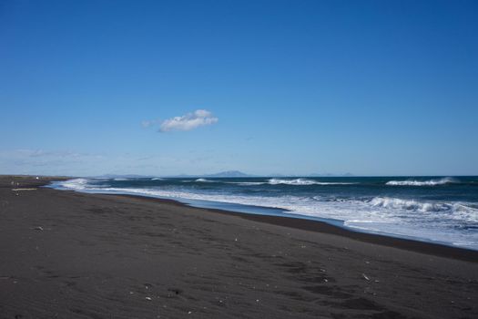 Seascape with Alatyrsky volcanic beach on the Kamchatka Peninsula.
